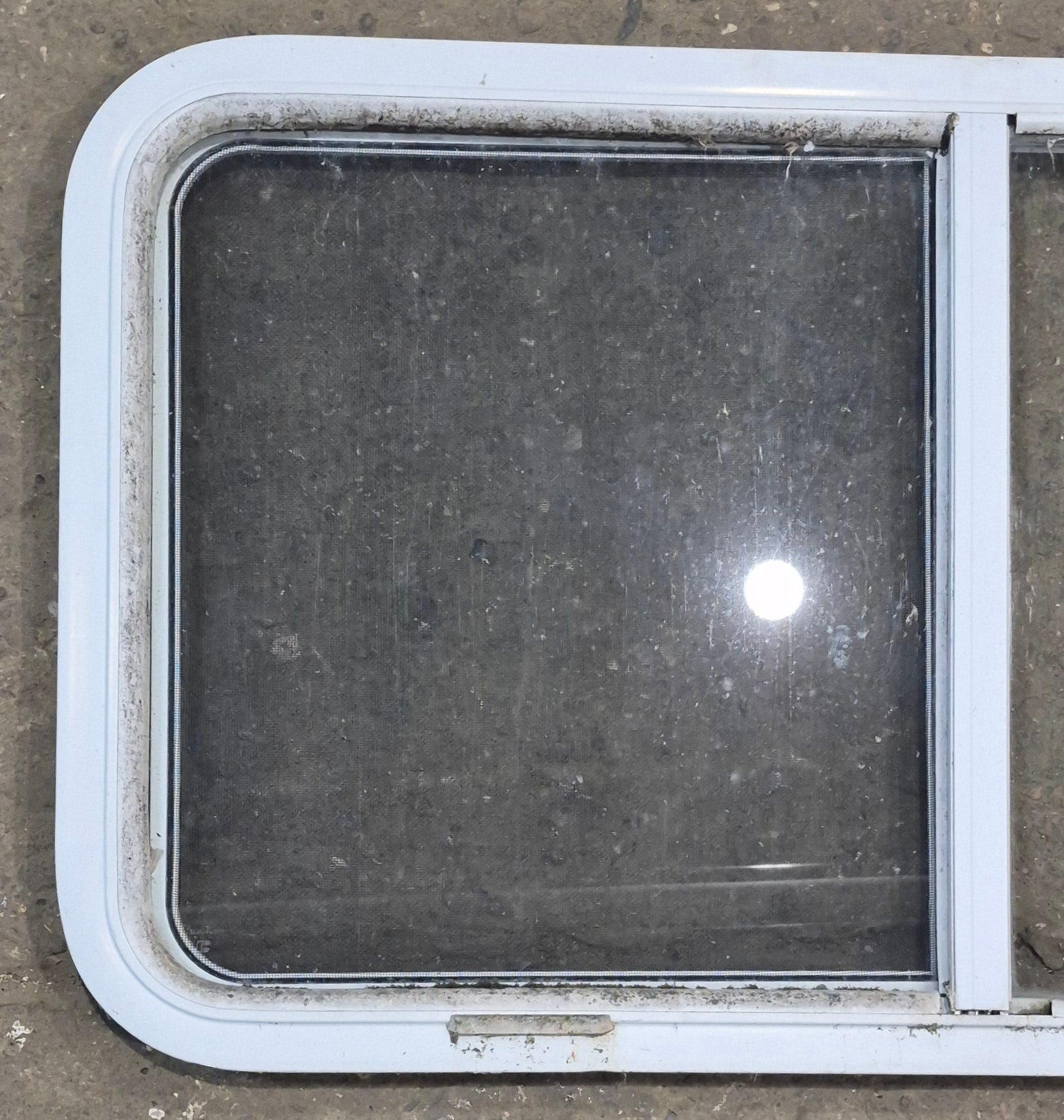 Used Slanted White Radius Opening Window : 46 3/4" W x 21 1/4" H x 1 1/4" D - Young Farts RV Parts