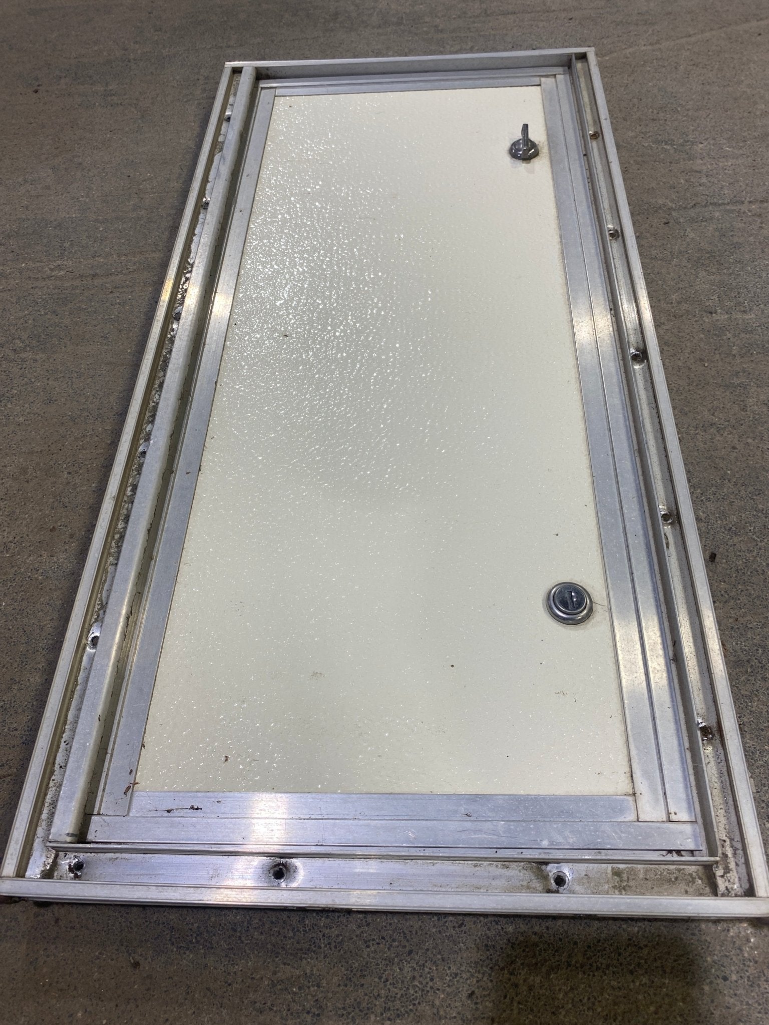 Used Square Cornered Cargo Door 23 1/2" W x 10 1/2" H X 1" D - Young Farts RV Parts
