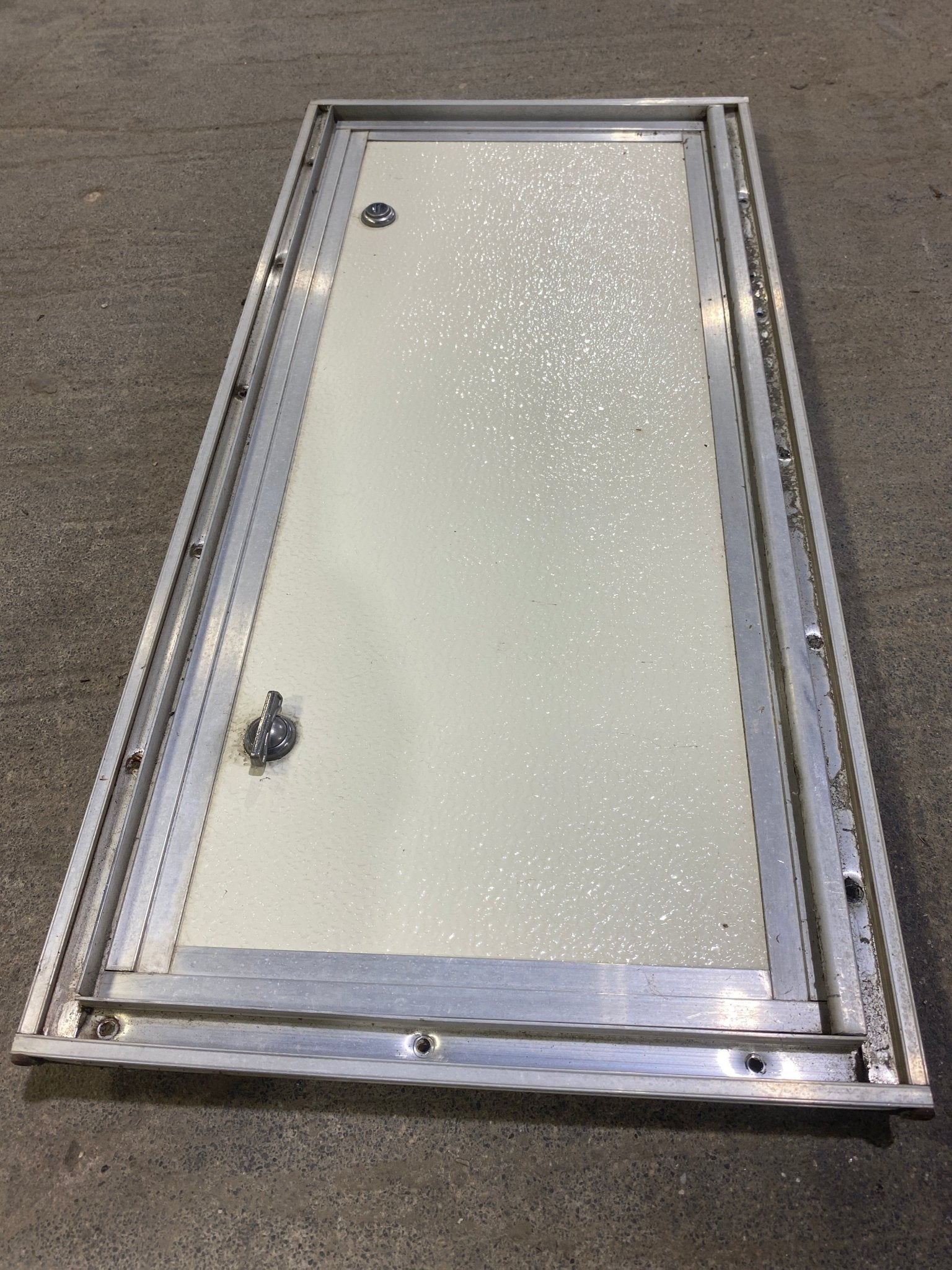 Used Square Cornered Cargo Door 23 1/2" W x 10 1/2" H X 1" D - Young Farts RV Parts
