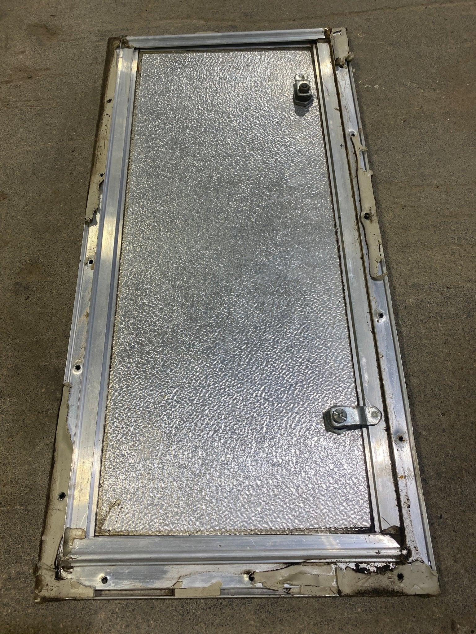 Used Square Cornered Cargo Door 23 1/2" W x 10 1/2" H X 1" D - Young Farts RV Parts