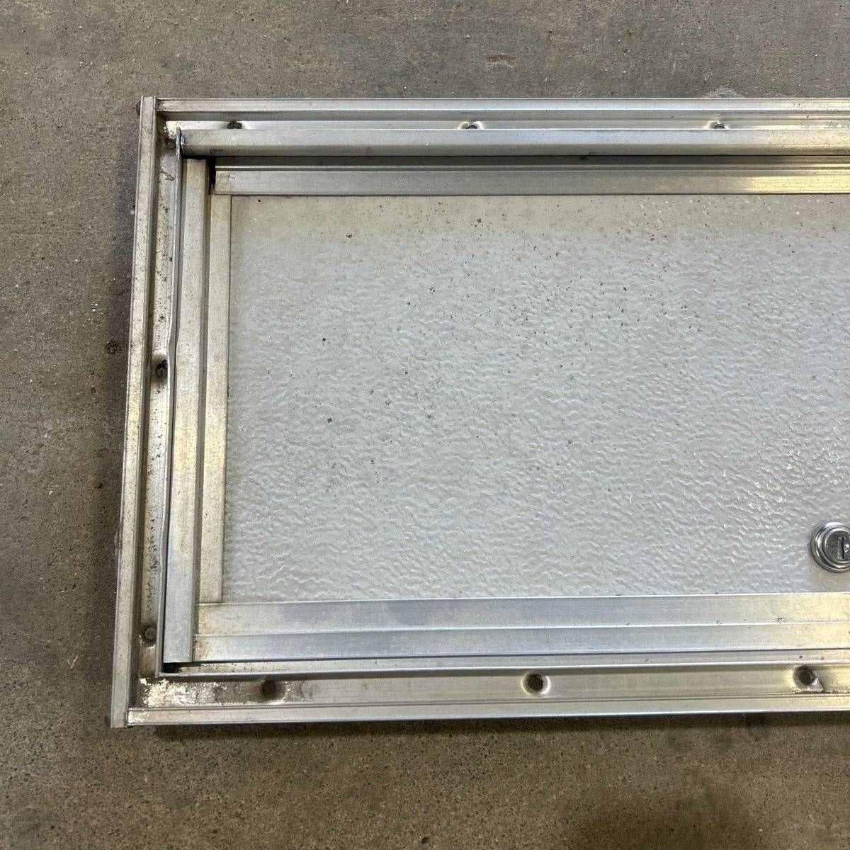 Used Square Cornered Cargo Door - 23.0 X 9.25 X 0.625 - Young Farts RV Parts