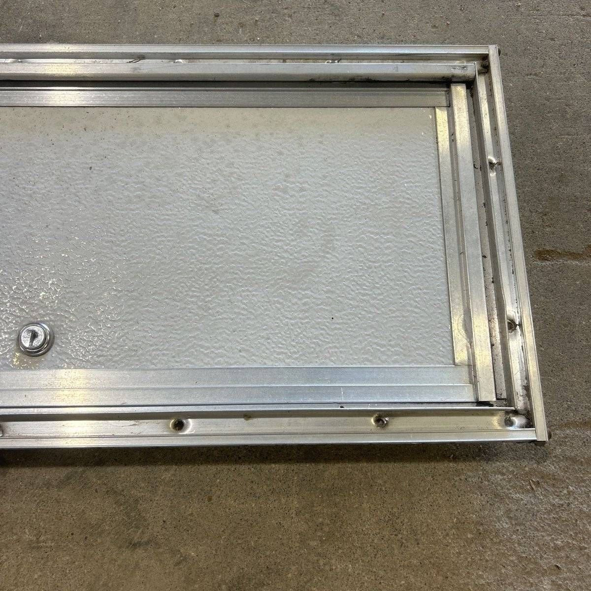 Used Square Cornered Cargo Door - 23.0 X 9.25 X 0.625 - Young Farts RV Parts
