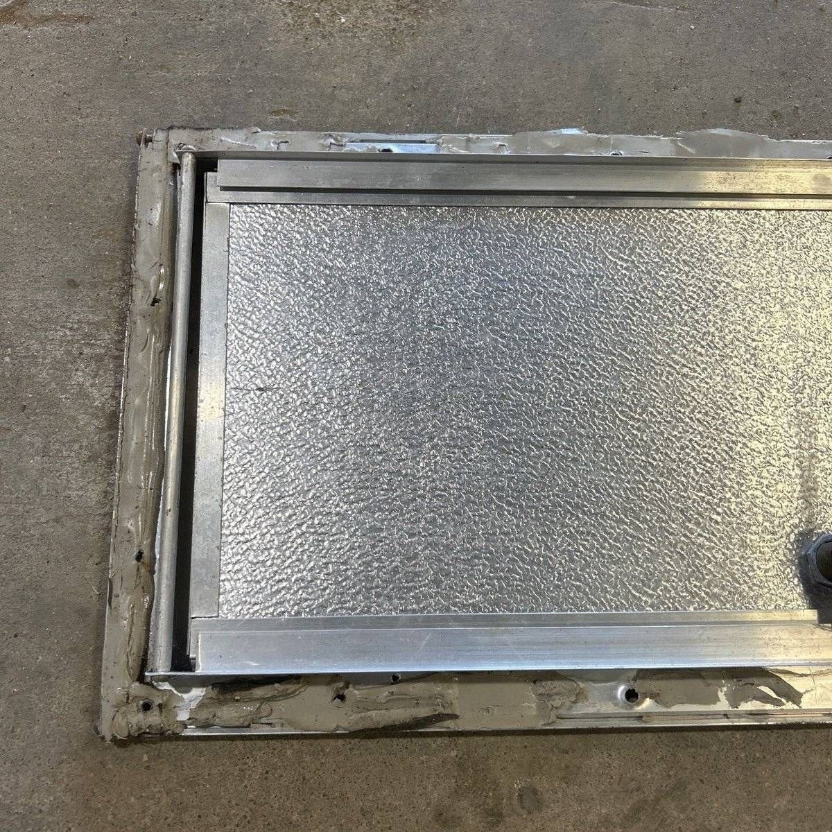 Used Square Cornered Cargo Door - 23.0 X 9.25 X 0.625 - Young Farts RV Parts