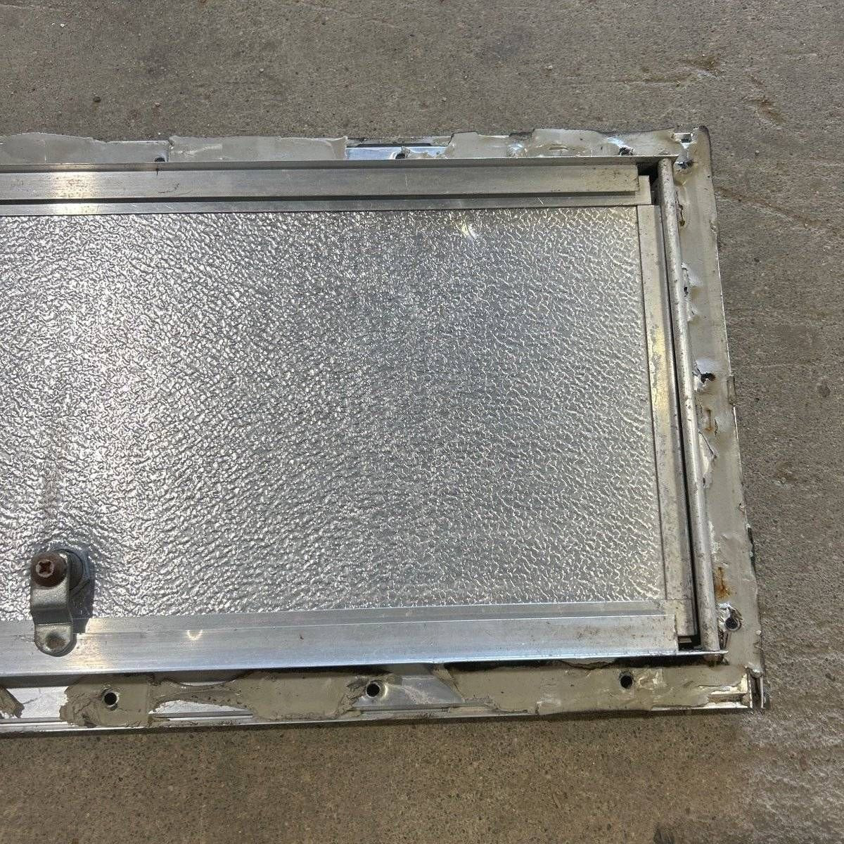 Used Square Cornered Cargo Door - 23.0 X 9.25 X 0.625 - Young Farts RV Parts