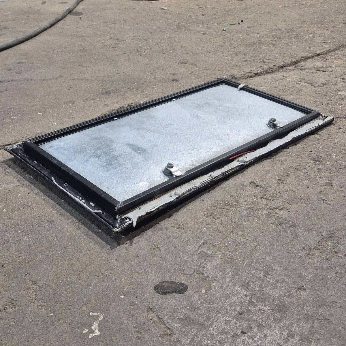 Used Square Cornered Cargo Door - 23.875 X 11.75 X 0.625 - Young Farts RV Parts