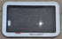 Used White Radius Emergency Opening Window : 35 1/4" W x 21 1/4" H x 1 7/8" D - Young Farts RV Parts