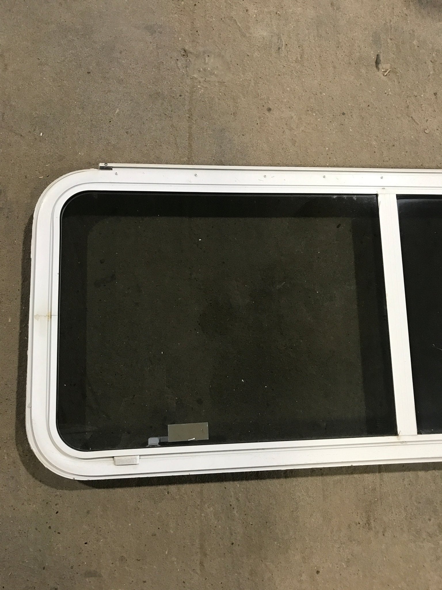 Used White Radius Emergency Opening Window : 54 1/4" W x 21 3/4" H x 2" D - Young Farts RV Parts