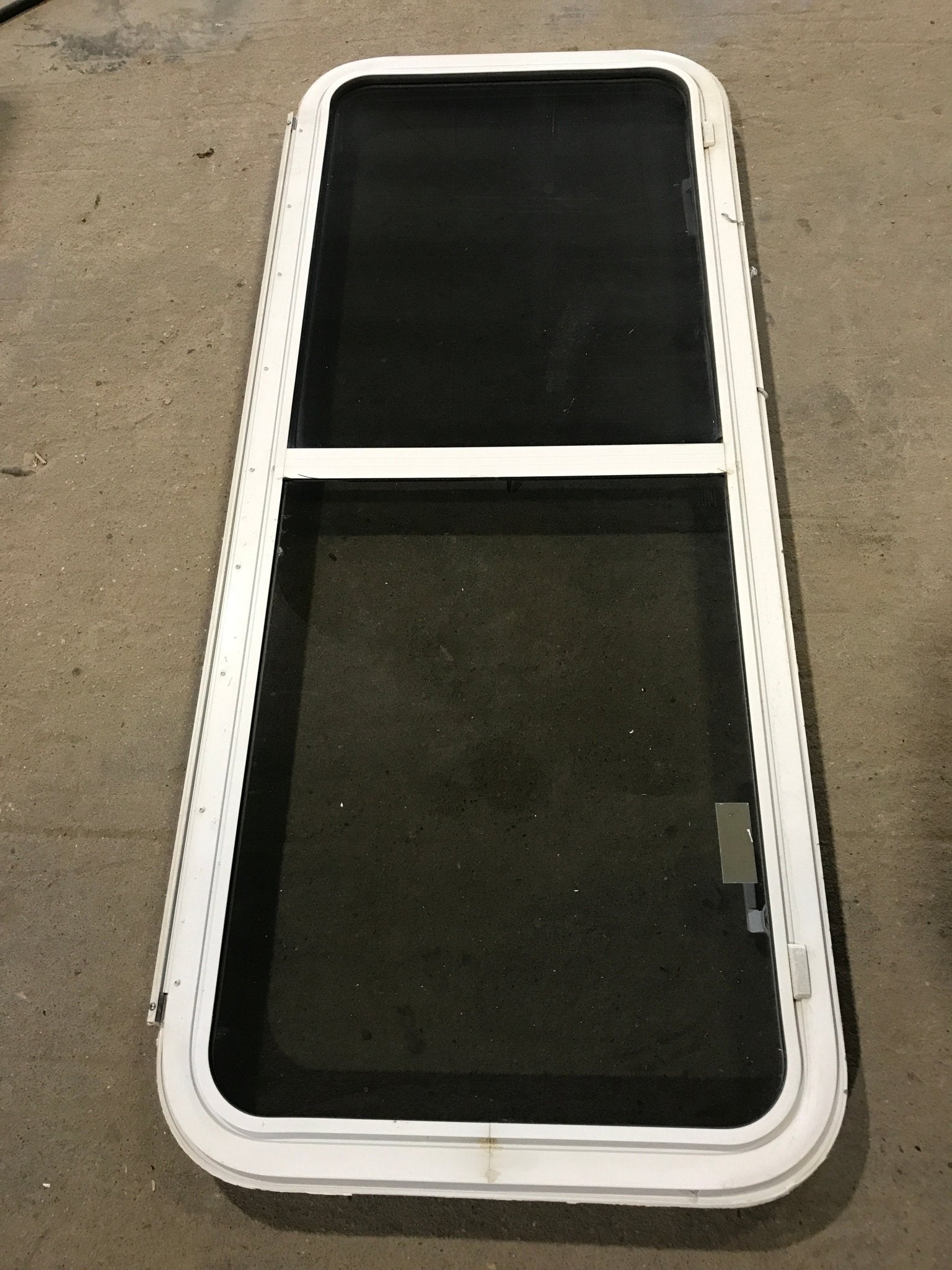 Used White Radius Emergency Opening Window : 54 1/4" W x 21 3/4" H x 2" D - Young Farts RV Parts