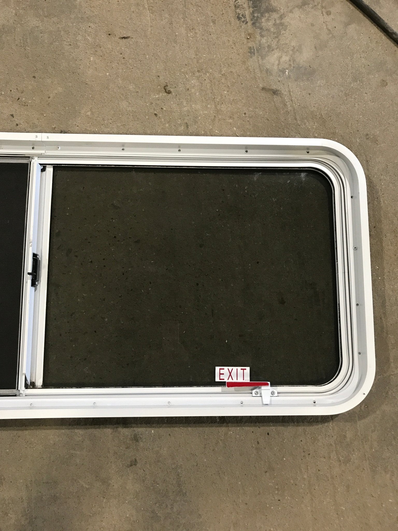 Used White Radius Emergency Opening Window : 54 1/4" W x 21 3/4" H x 2" D - Young Farts RV Parts