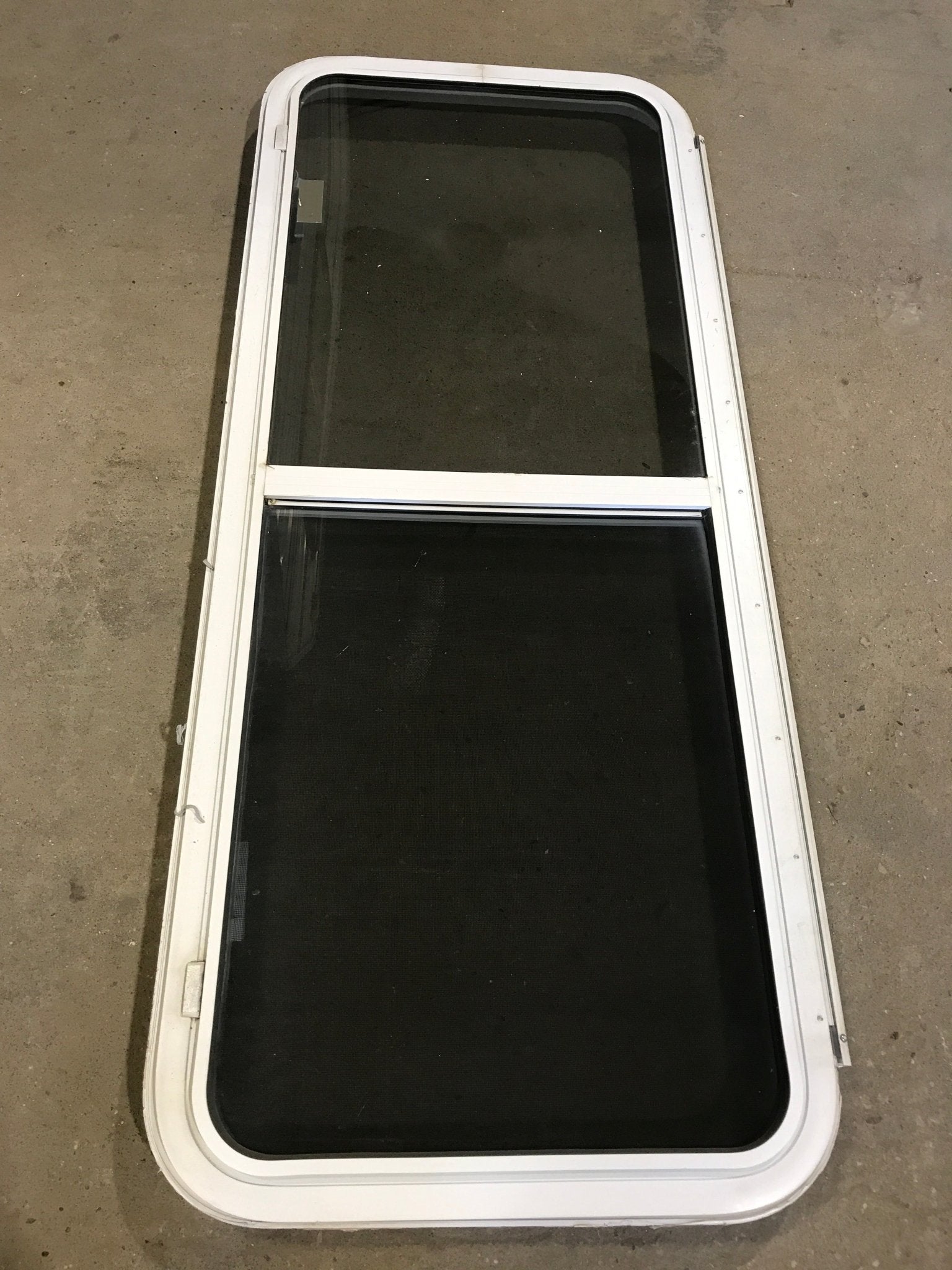Used White Radius Emergency Opening Window : 54 1/4" W x 21 3/4" H x 2" D - Young Farts RV Parts