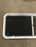 Used White Radius Emergency Opening Window : 54 1/4" W x 21 3/4" H x 2" D - Young Farts RV Parts