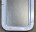 Used White Radius Non Opening Window : 13 1/2" W x 23 1/2" H x 1 7/8" D - Young Farts RV Parts