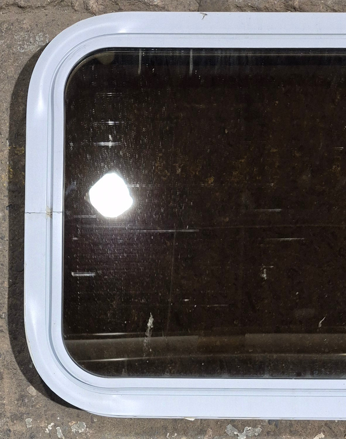 Used White Radius Non Opening Window : 24 1/4" W x 16 3/4" H x 1 7/8" D - Young Farts RV Parts