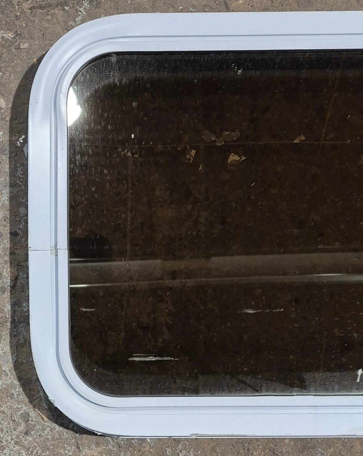 Used White Radius Non Opening Window : 24 1/4" W x 16 3/4" H x 1 7/8" D - Young Farts RV Parts