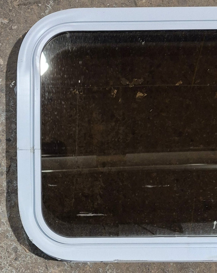 Used White Radius Non Opening Window : 24 1/4" W x 16 3/4" H x 1 7/8" D - Young Farts RV Parts