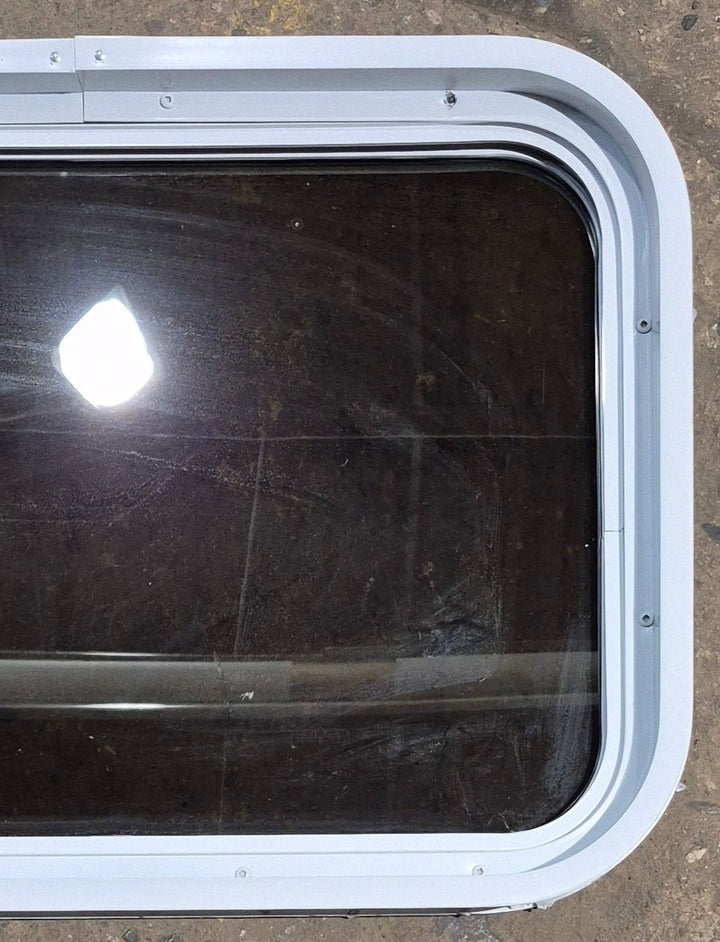 Used White Radius Non Opening Window : 24 1/4" W x 16 3/4" H x 1 7/8" D - Young Farts RV Parts