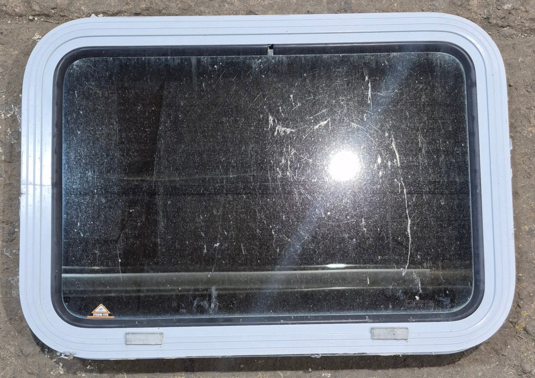 Used White Radius Non Opening Window : 24" W x 16 1/2" H x 1 7/8" D - Young Farts RV Parts