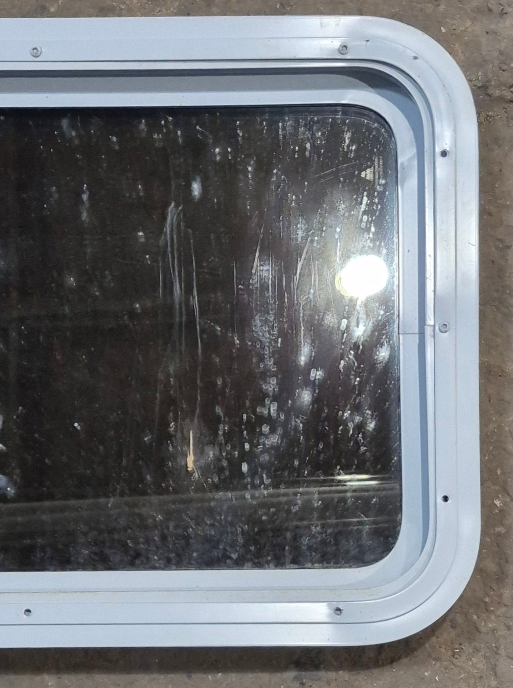 Used White Radius Non Opening Window : 24" W x 16 1/2" H x 1 7/8" D - Young Farts RV Parts