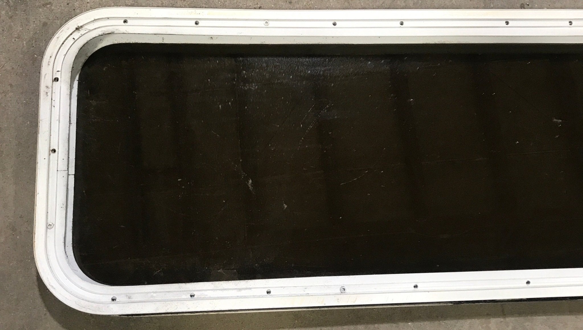 Used White Radius Non Opening Window : 45 1/2" W x 15 1/2" H x 1 7/8" D - Young Farts RV Parts
