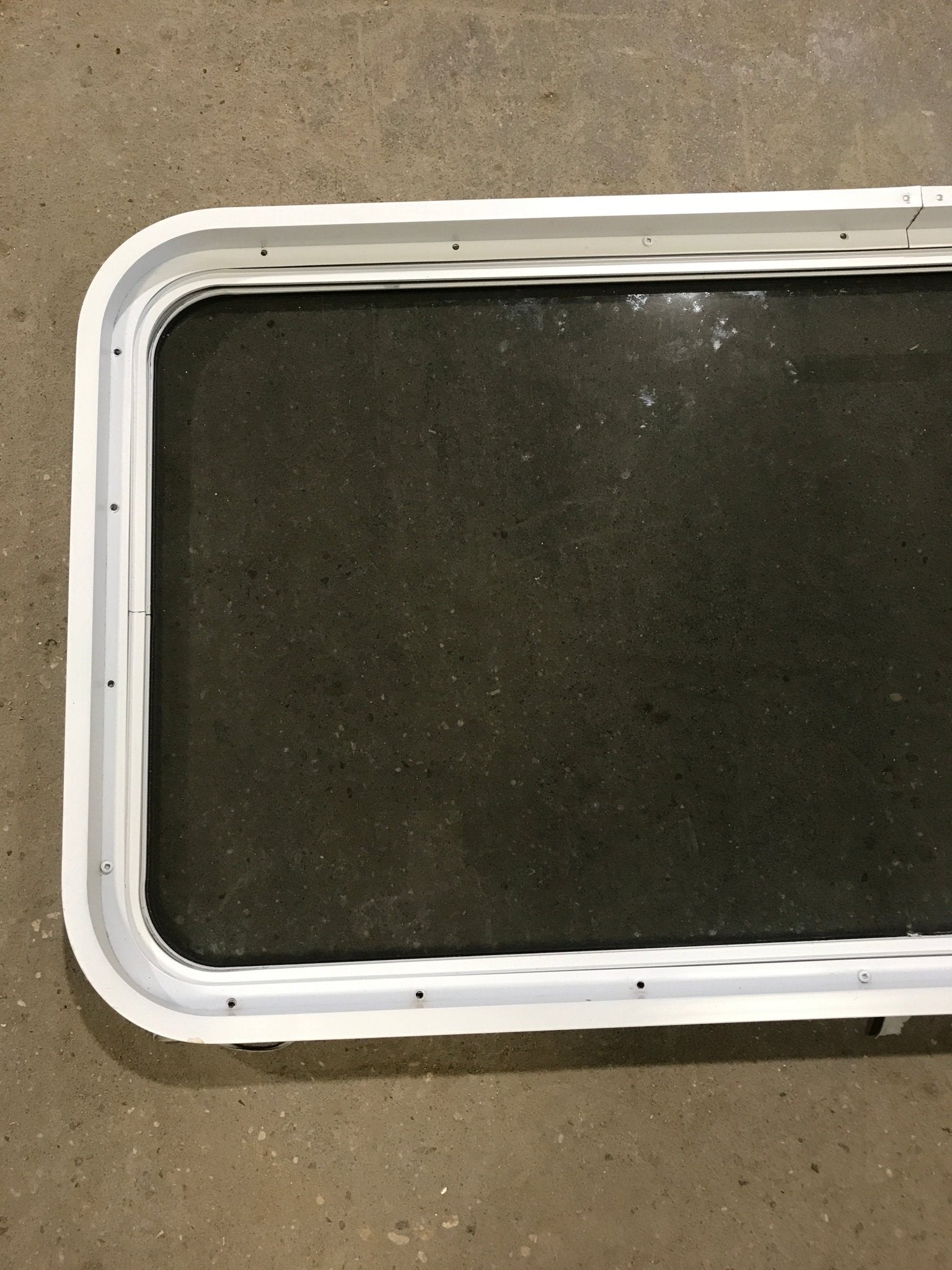 Used White Radius Non Opening Window : 47 3/4" W x 21 1/2" H x 2" D - Young Farts RV Parts