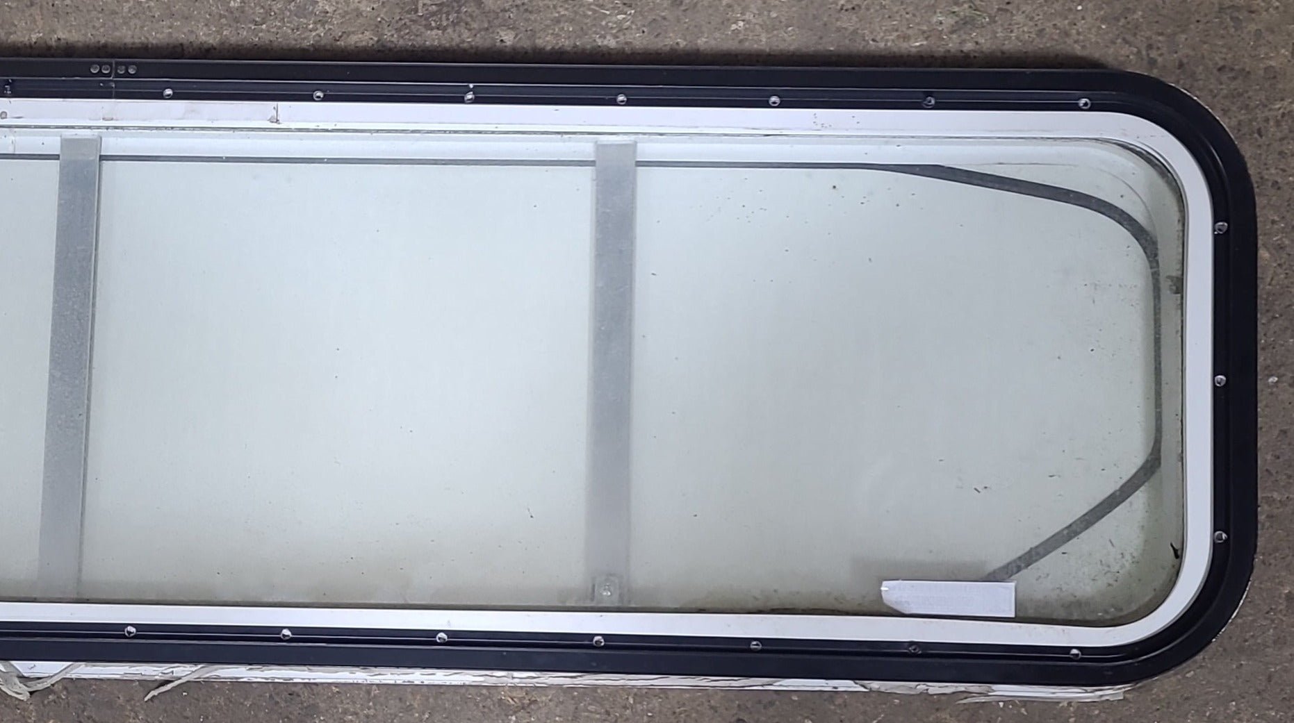 Used White Radius Non-Opening Window With Rock Guard Cover : 59 1/4" W x 14 1/4" H x 1 7/8" D - Young Farts RV Parts