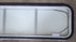 Used White Radius Non-Opening Window With Rock Guard Cover : 59 1/4" W x 14 1/4" H x 1 7/8" D - Young Farts RV Parts