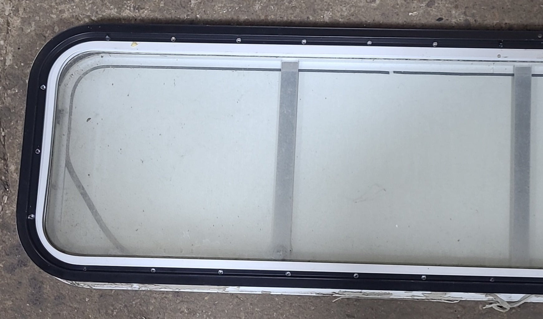 Used White Radius Non-Opening Window With Rock Guard Cover : 59 1/4" W x 14 1/4" H x 1 7/8" D - Young Farts RV Parts