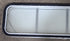 Used White Radius Non-Opening Window With Rock Guard Cover : 59 1/4" W x 14 1/4" H x 1 7/8" D - Young Farts RV Parts