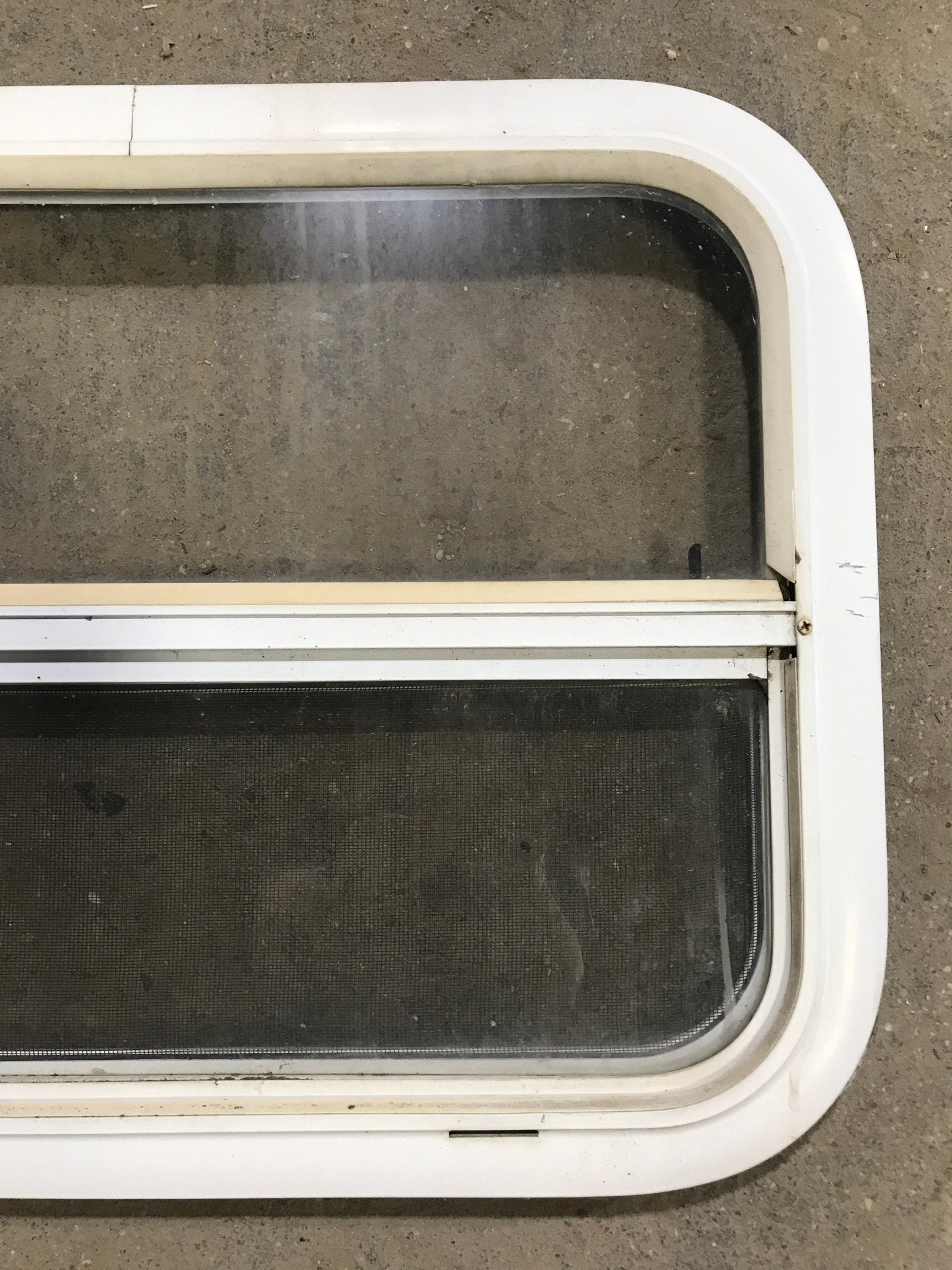 Used White Radius Opening Window : 23 1/2" W x 17 1/2" H x 1 1/2" D - Young Farts RV Parts