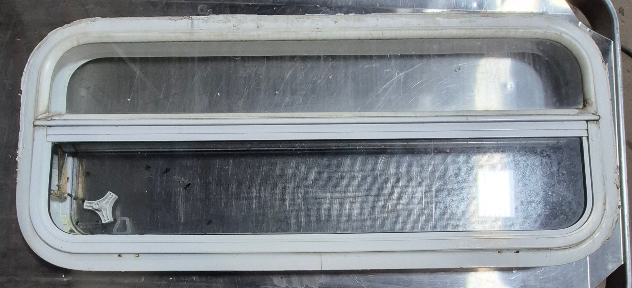 Used White Radius Opening Window : 35 1/2" W x 14 1/4" H x 1 1/4" D - Young Farts RV Parts