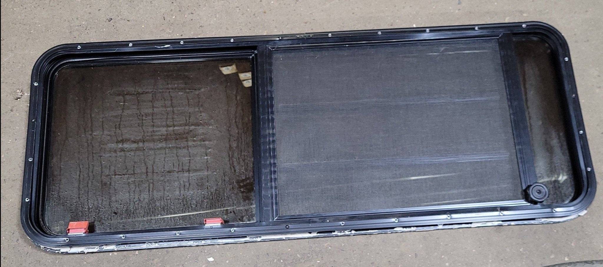 Used Black Radius Emergency Opening Window : 21 3/4" H X 60" W X 2" D - Young Farts RV Parts