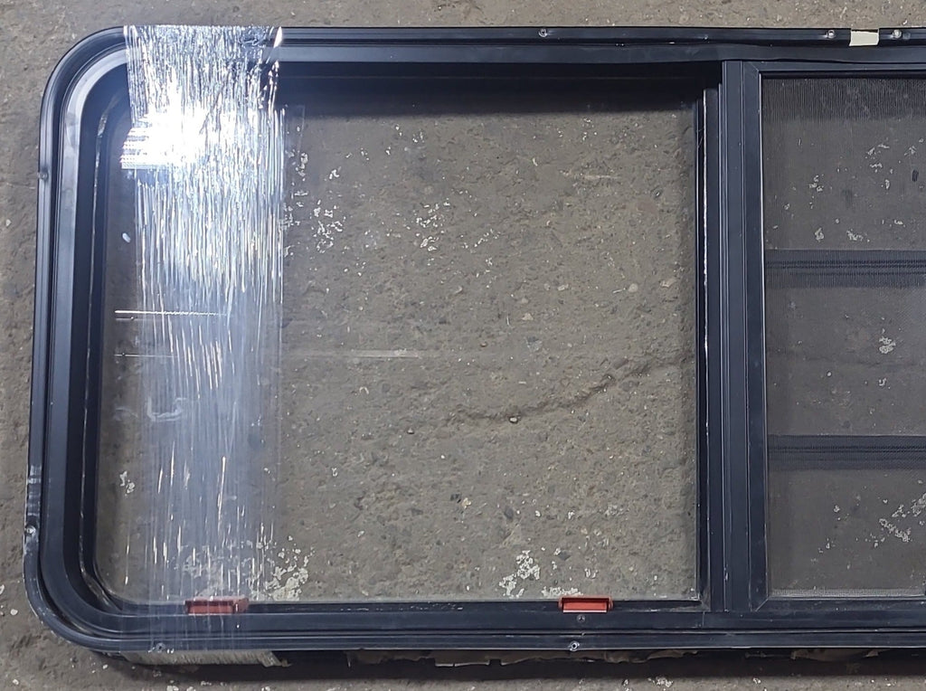 Used Black Radius Emergency Opening Window : 21 3/4" W x 59 3/4" H x 1 1/4" D - Young Farts RV Parts