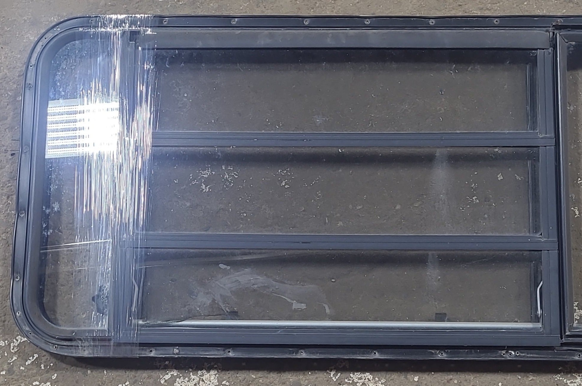 Used Black Radius Emergency Opening Window : 21 3/4" W x 59 3/4" H x 1 1/4" D - Young Farts RV Parts