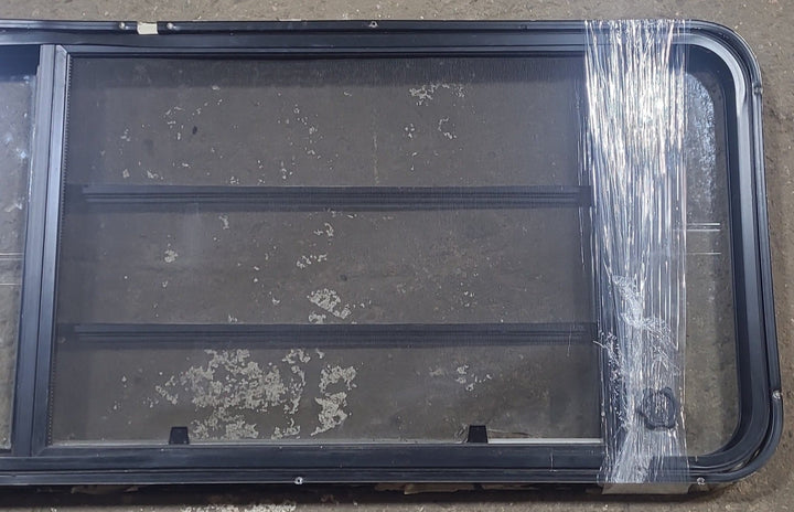 Used Black Radius Emergency Opening Window : 21 3/4" W x 59 3/4" H x 1 1/4" D - Young Farts RV Parts