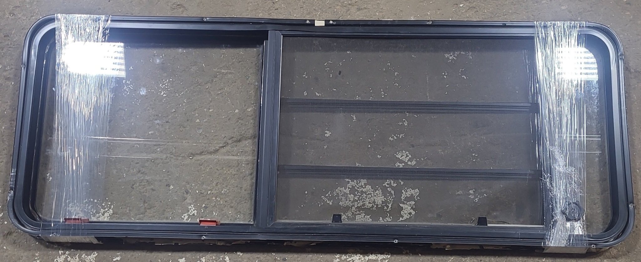 Used Black Radius Emergency Opening Window : 21 3/4" W x 59 3/4" H x 1 1/4" D - Young Farts RV Parts