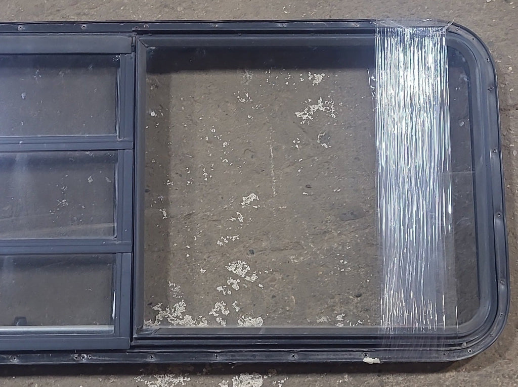 Used Black Radius Emergency Opening Window : 21 3/4" W x 59 3/4" H x 1 1/4" D - Young Farts RV Parts