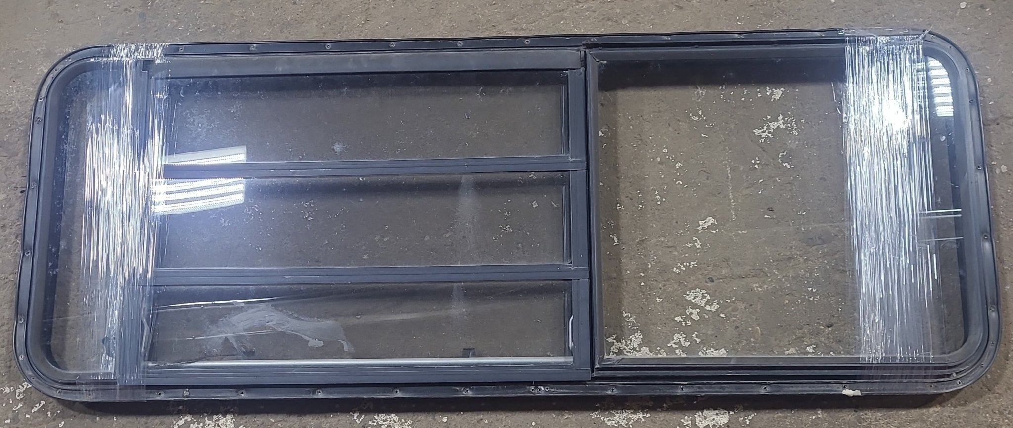 Used Black Radius Emergency Opening Window : 21 3/4" W x 59 3/4" H x 1 1/4" D - Young Farts RV Parts