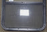 Used Black Radius Emergency Opening Window : 26 1/4" W x 34 1/4" H x 1 7/8" D - Young Farts RV Parts