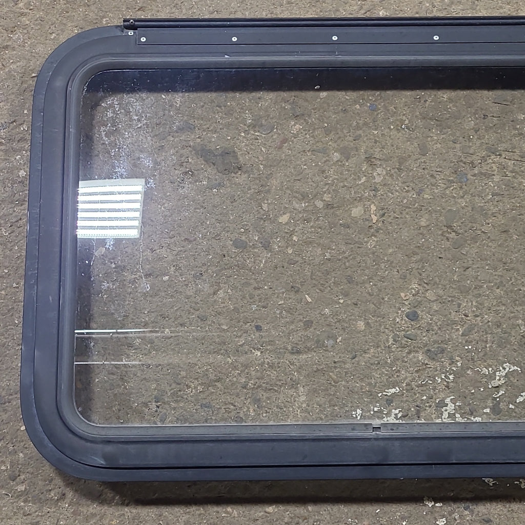 Used Black Radius Emergency Opening Window : 29 1/2" W x 21 1/2" H x 1 13/8" D - Young Farts RV Parts