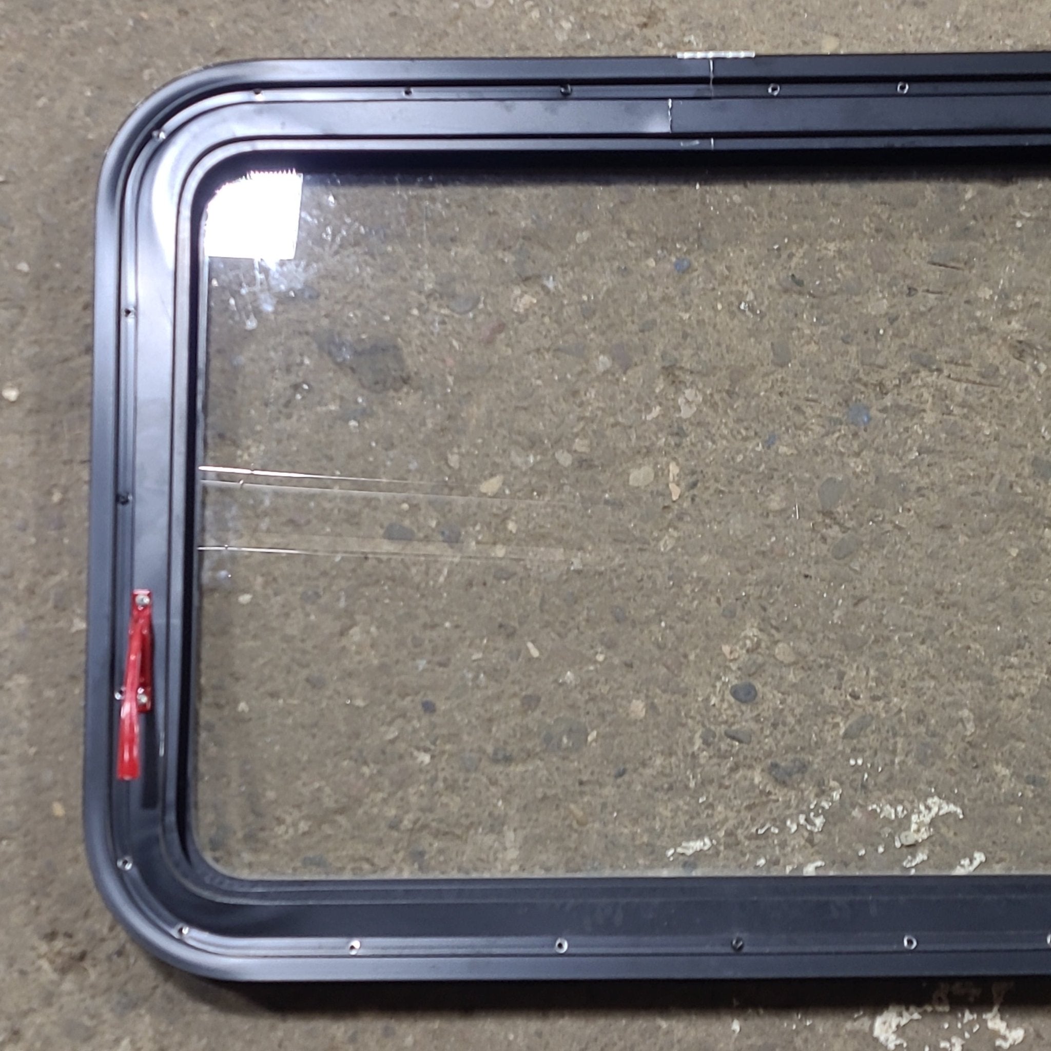 Used Black Radius Emergency Opening Window : 29 1/2" W x 21 1/2" H x 1 13/8" D - Young Farts RV Parts