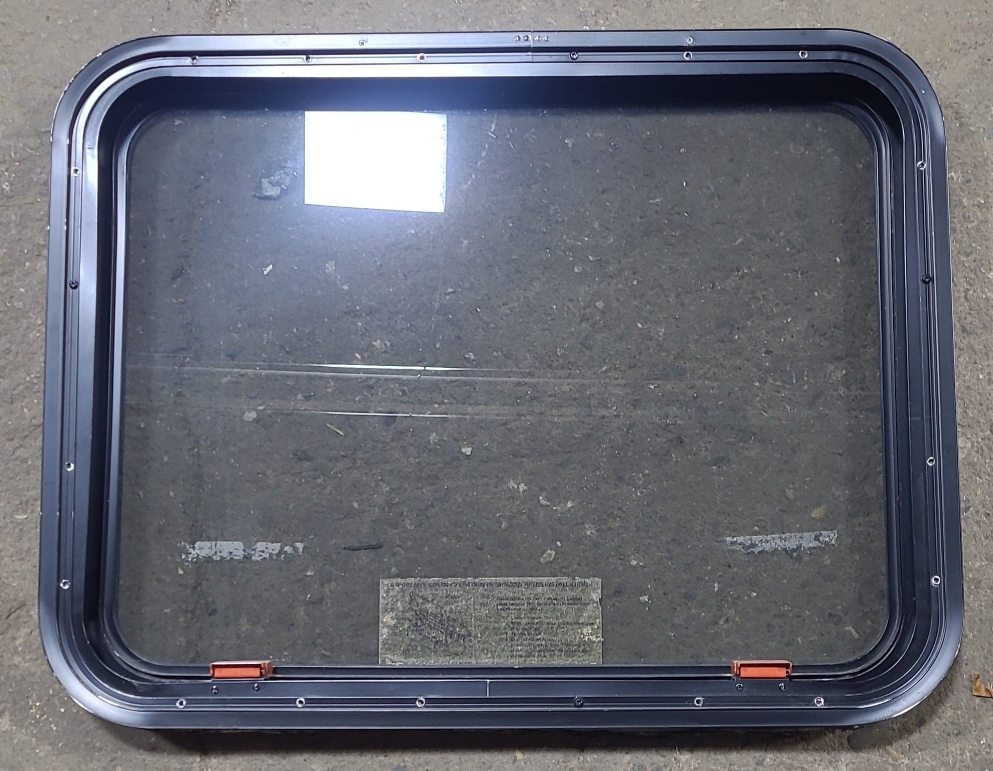 Used Black Radius Emergency Opening Window : 29 3/8" W x 22 1/2" H x 1 7/8" D - Young Farts RV Parts