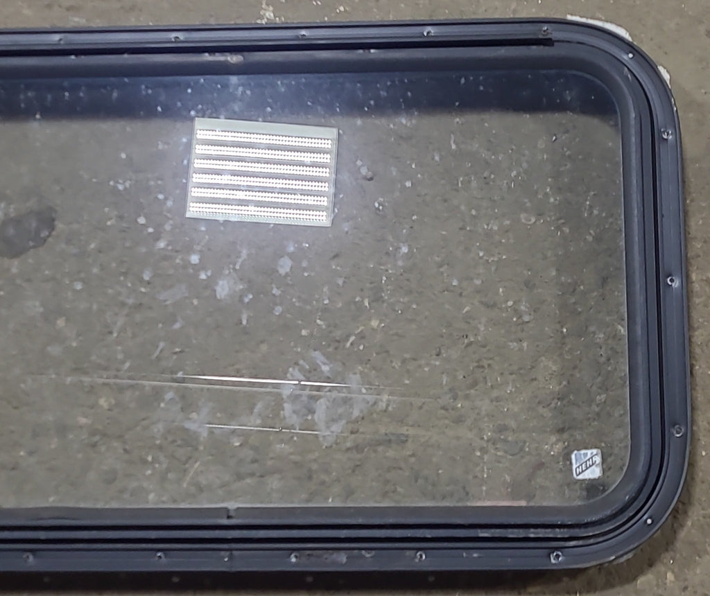 Used Black Radius Emergency Opening Window : 30 3/4" W x 18 3/4" H x 1 5/8" D - Young Farts RV Parts