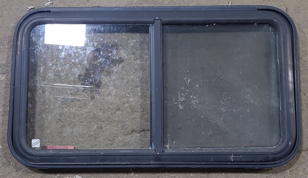 Used Black Radius Emergency Opening Window : 35 1/2" W x 19 1/2" H x 1 1/8" D - Young Farts RV Parts