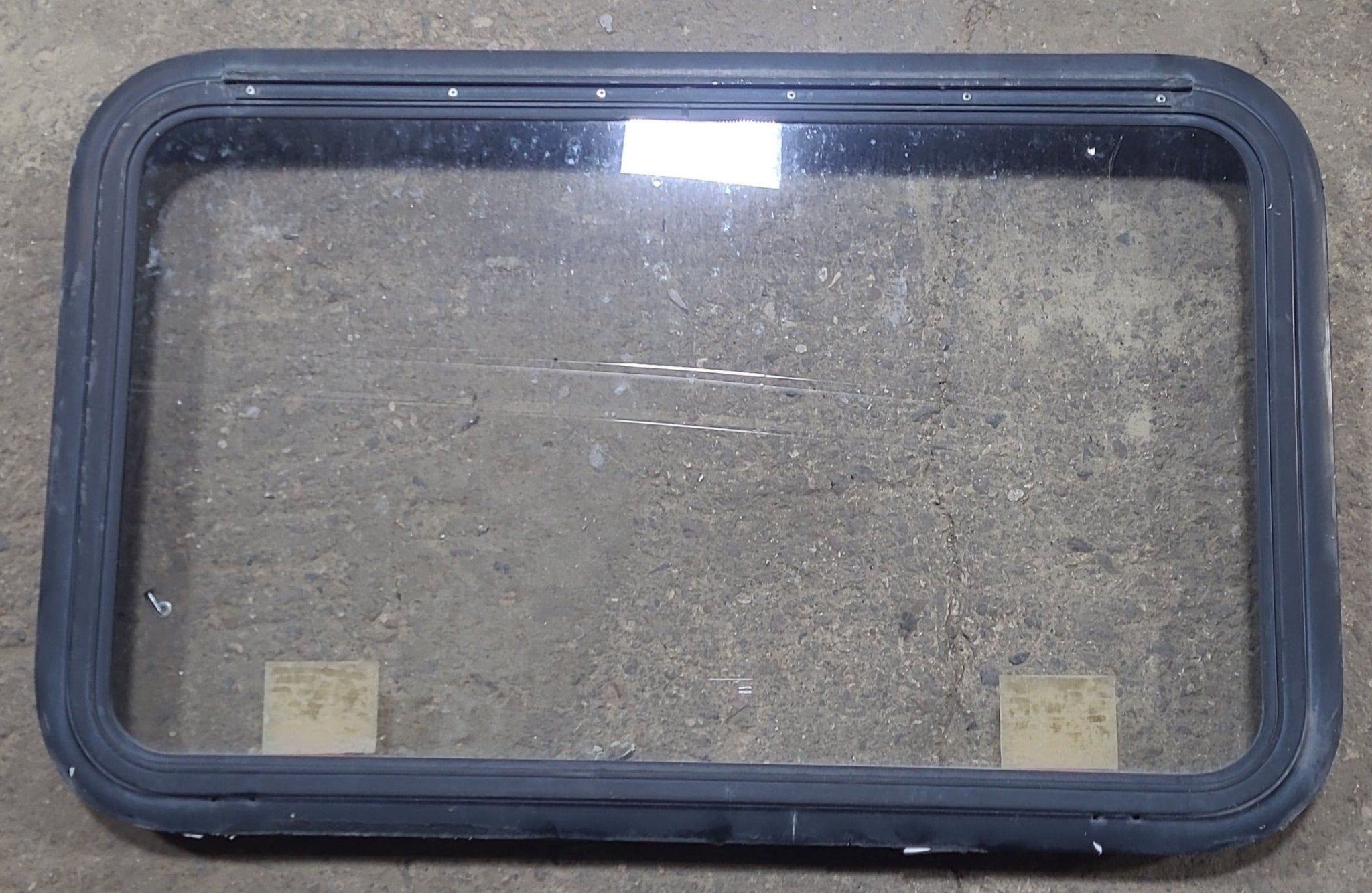 Used Black Radius Emergency Opening Window : 35 1/4" W x 21 1/2" H x 1 7/8" D - Young Farts RV Parts