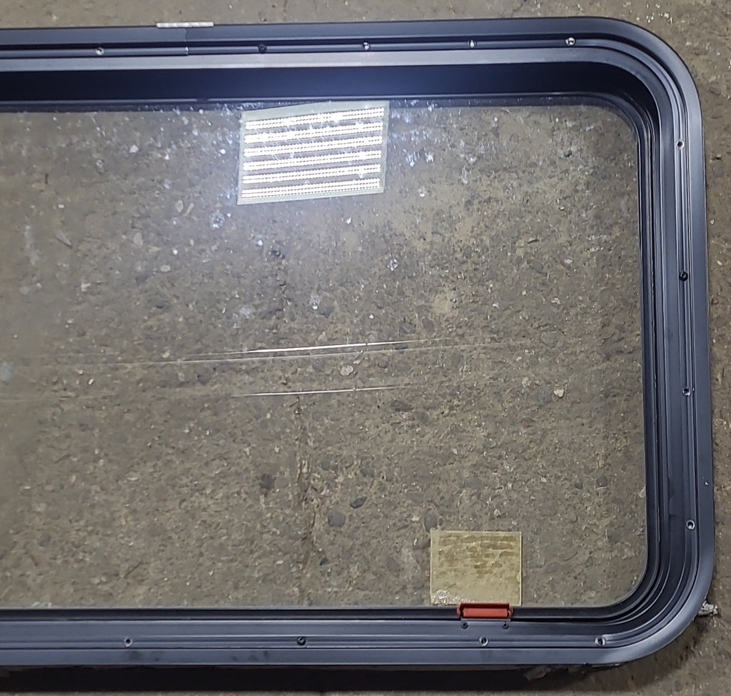 Used Black Radius Emergency Opening Window : 35 1/4" W x 21 1/2" H x 1 7/8" D - Young Farts RV Parts