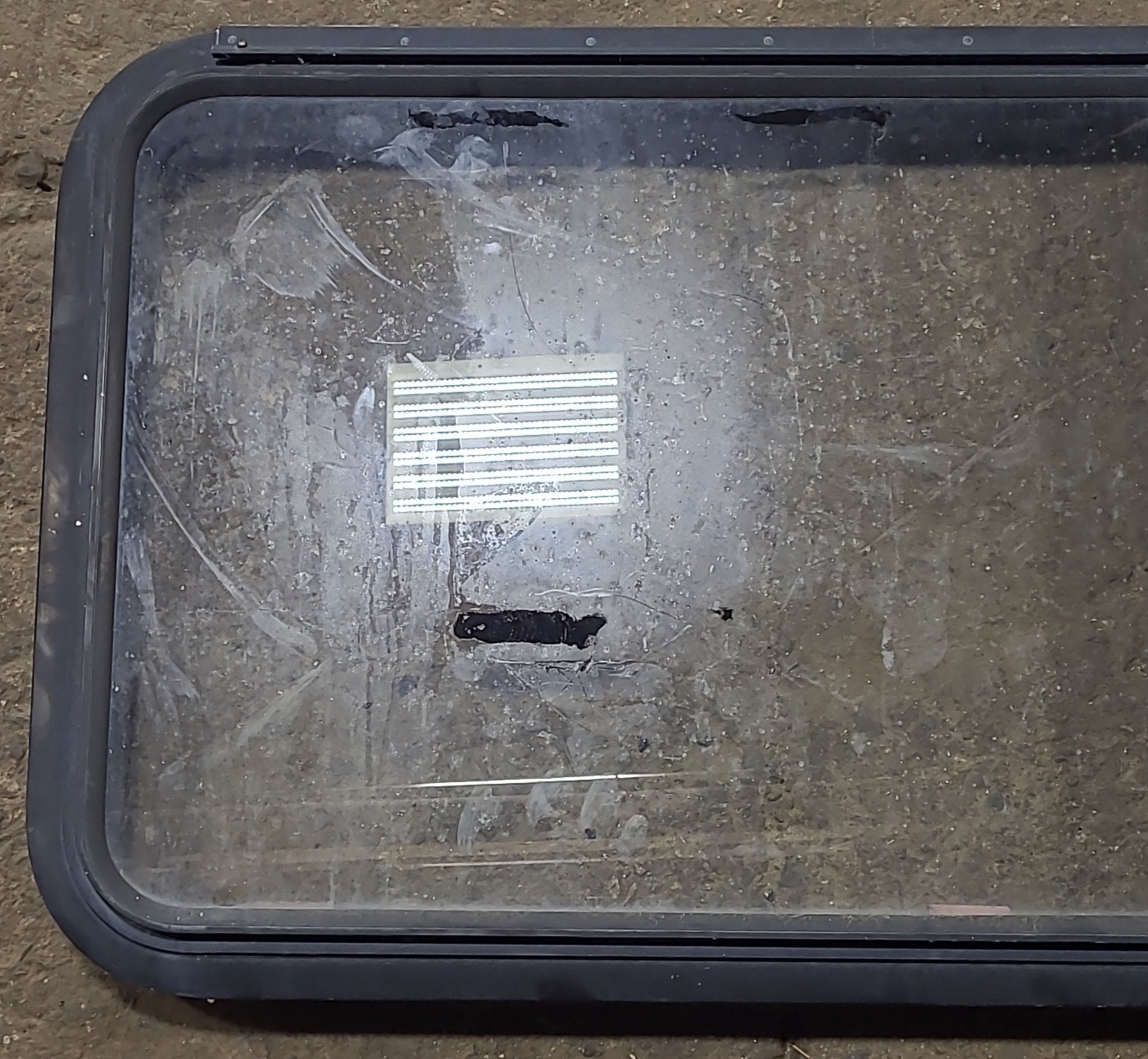 Used Black Radius Emergency Opening Window : 41 3/8" W x 21 5/8" H x 1 7/8" D - Young Farts RV Parts