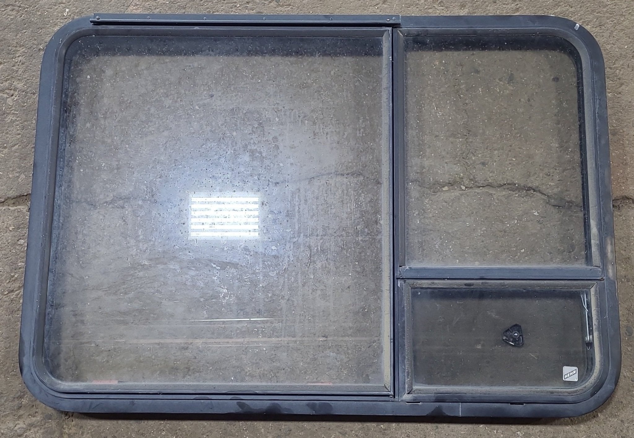 Used Black Radius Emergency Opening Window : 41 3/8" W x 28 5/8" H x 1 7/8" D - Young Farts RV Parts