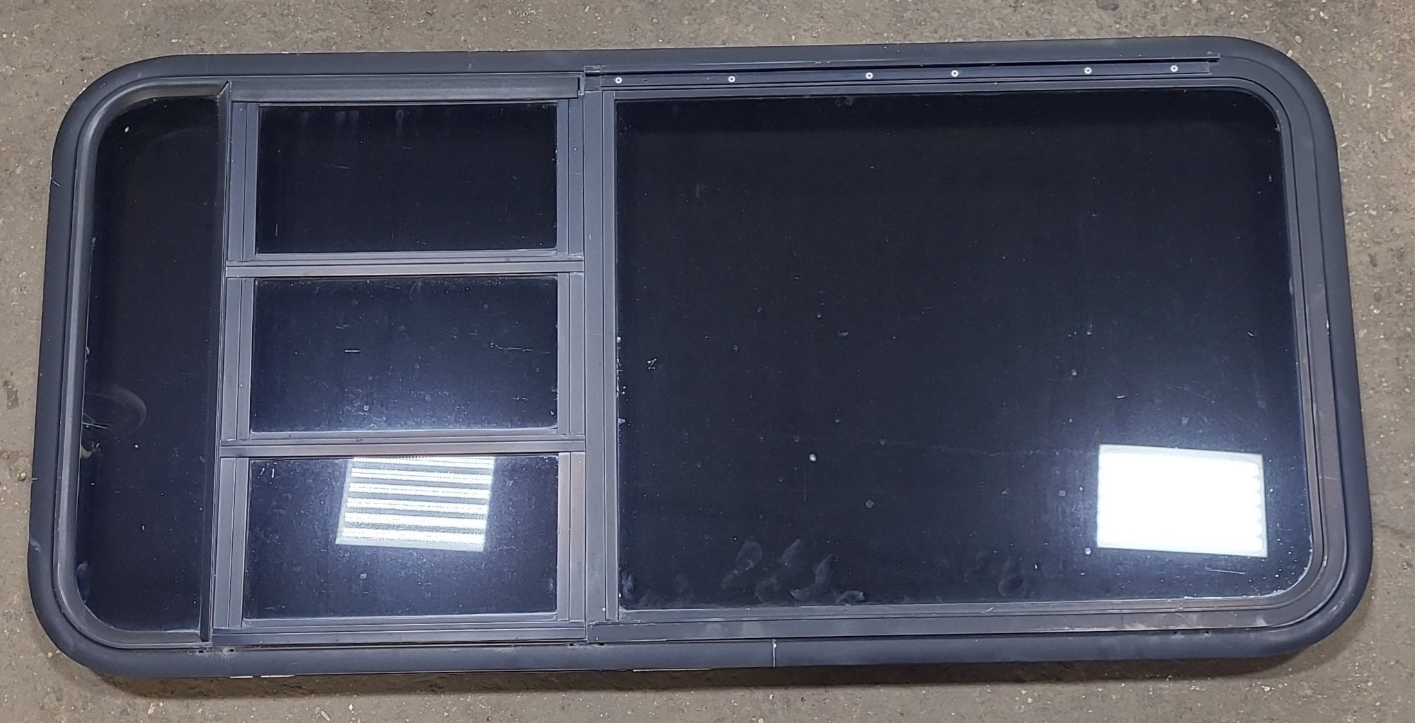 Used Black Radius Emergency Opening Window : 47 1/4" W x 22 1/2" H x 1 3/4" D - Young Farts RV Parts