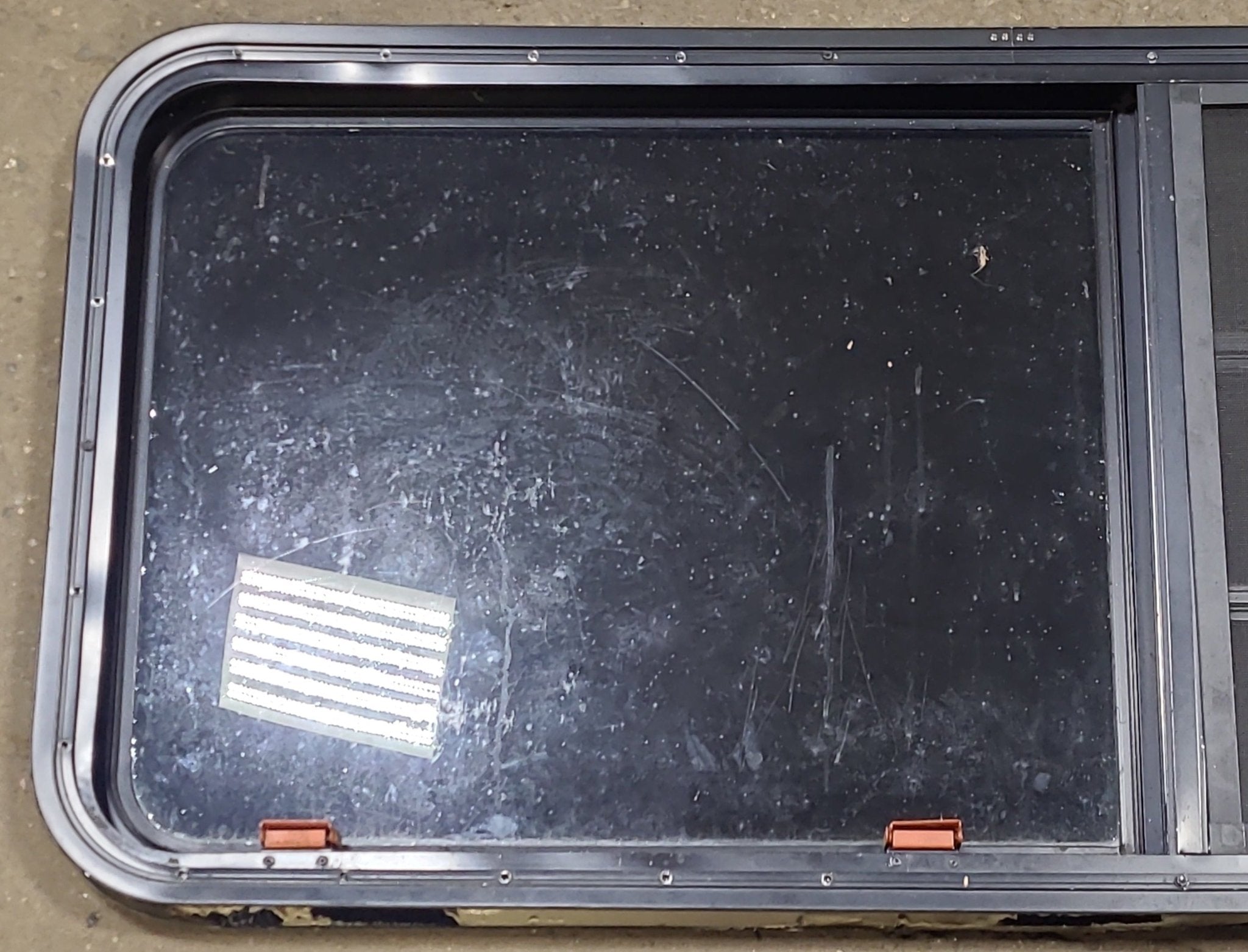 Used Black Radius Emergency Opening Window : 47 1/4" W x 22 1/2" H x 1 3/4" D - Young Farts RV Parts
