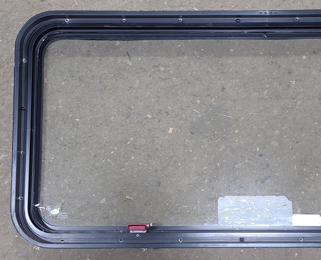 Used Black Radius Emergency Opening Window : 48 1/2" W x 21 3/4" H x 1 3/4" D - Young Farts RV Parts